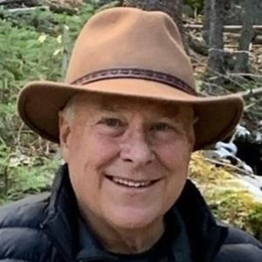 Photo of smiling man wearing a hat.